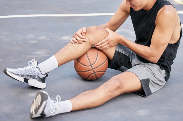 Athlete with sore leg muscle