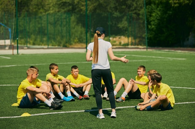 Soccer coach explaining to yellow team