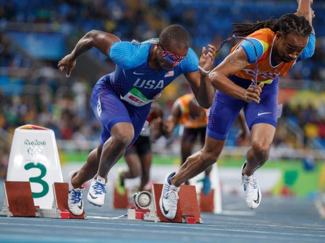 David Brown of the USA and his guide Mason Rhodes competing in the Men's 400m - T11 Round 1 Heat 1 during the Paralympic Games in Rio de Janeiro, Brazil