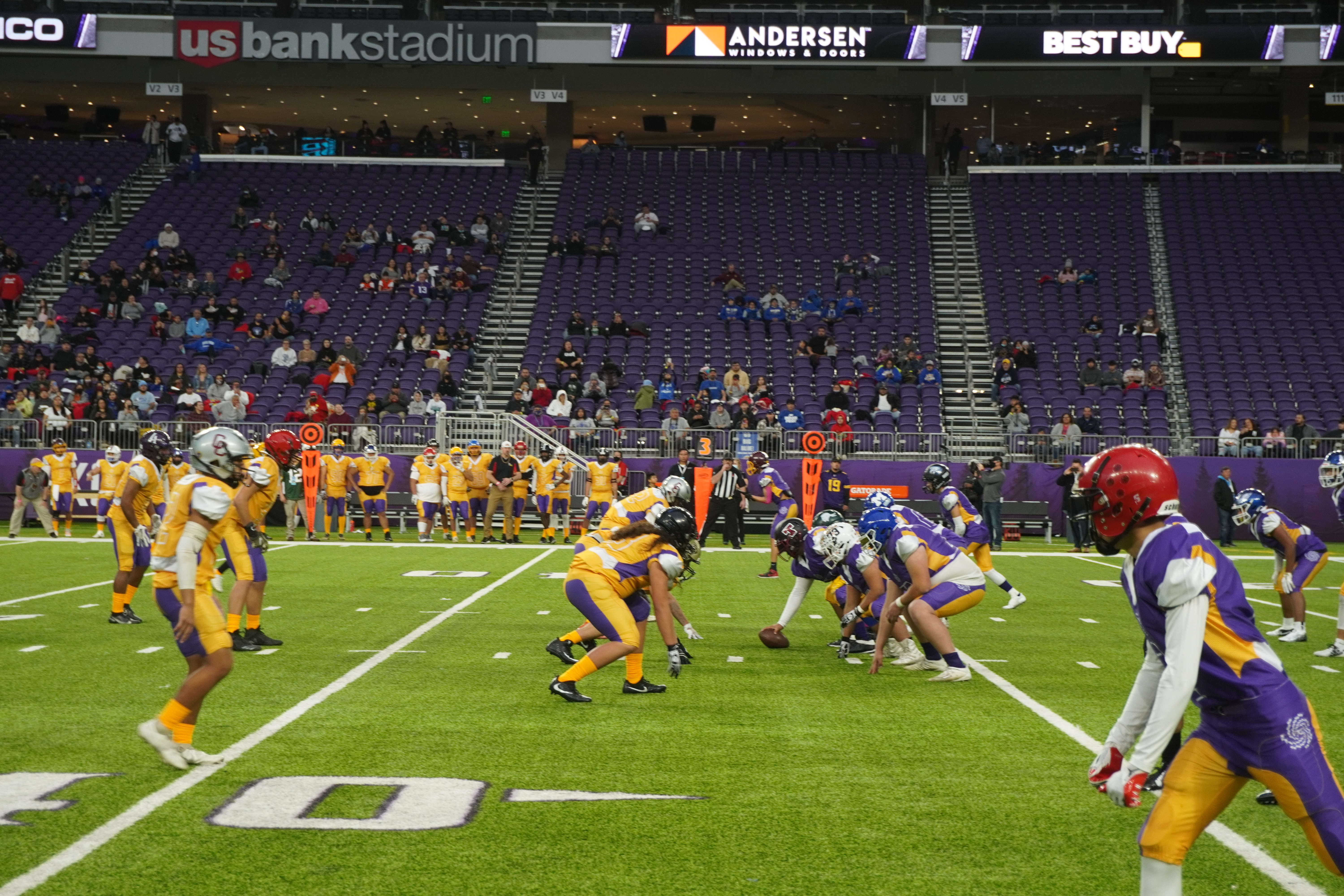 Players line up for to start a play at Vikings Stadium
