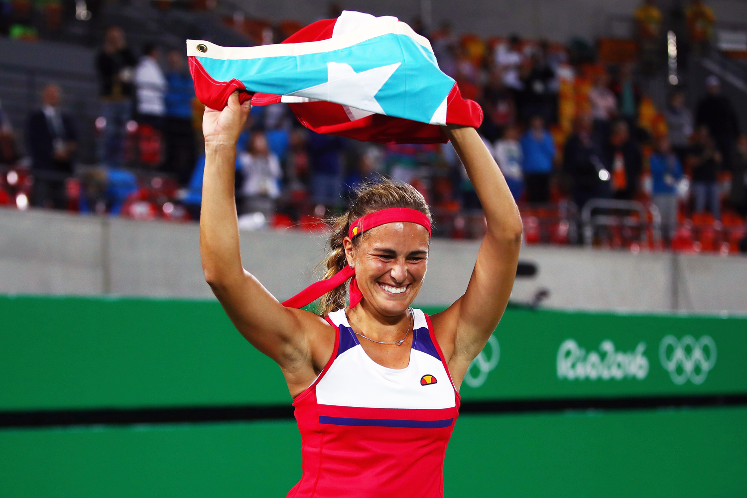Monica Puig with Flag