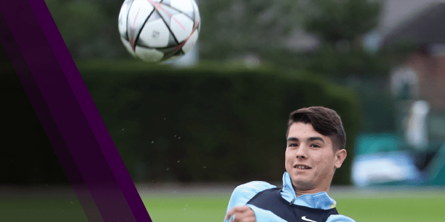 Boy kicking soccer ball