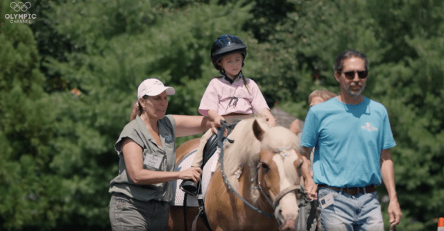 Young Girl Riding A Horse