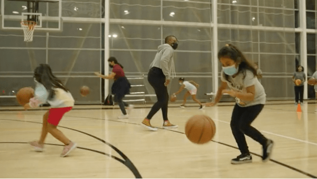 Girl dribbling basketball
