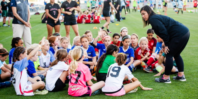 school coach with young athletes.